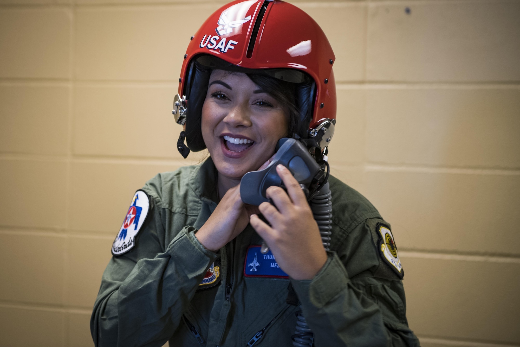Noelani Mathews, multimedia journalist, laughs while trying on her helmet before her media flight with the U.S. Air Force Thunderbirds, Oct. 27, 2017, at Moody Air Force Base, Ga. The Thunderbirds, based out of Nellis Air Force Base, Nev., are the Air Force’s premier aerial demonstration team, performing at air shows and special events worldwide. (U.S. Air Force photo by Senior Airman Janiqua P. Robinson)