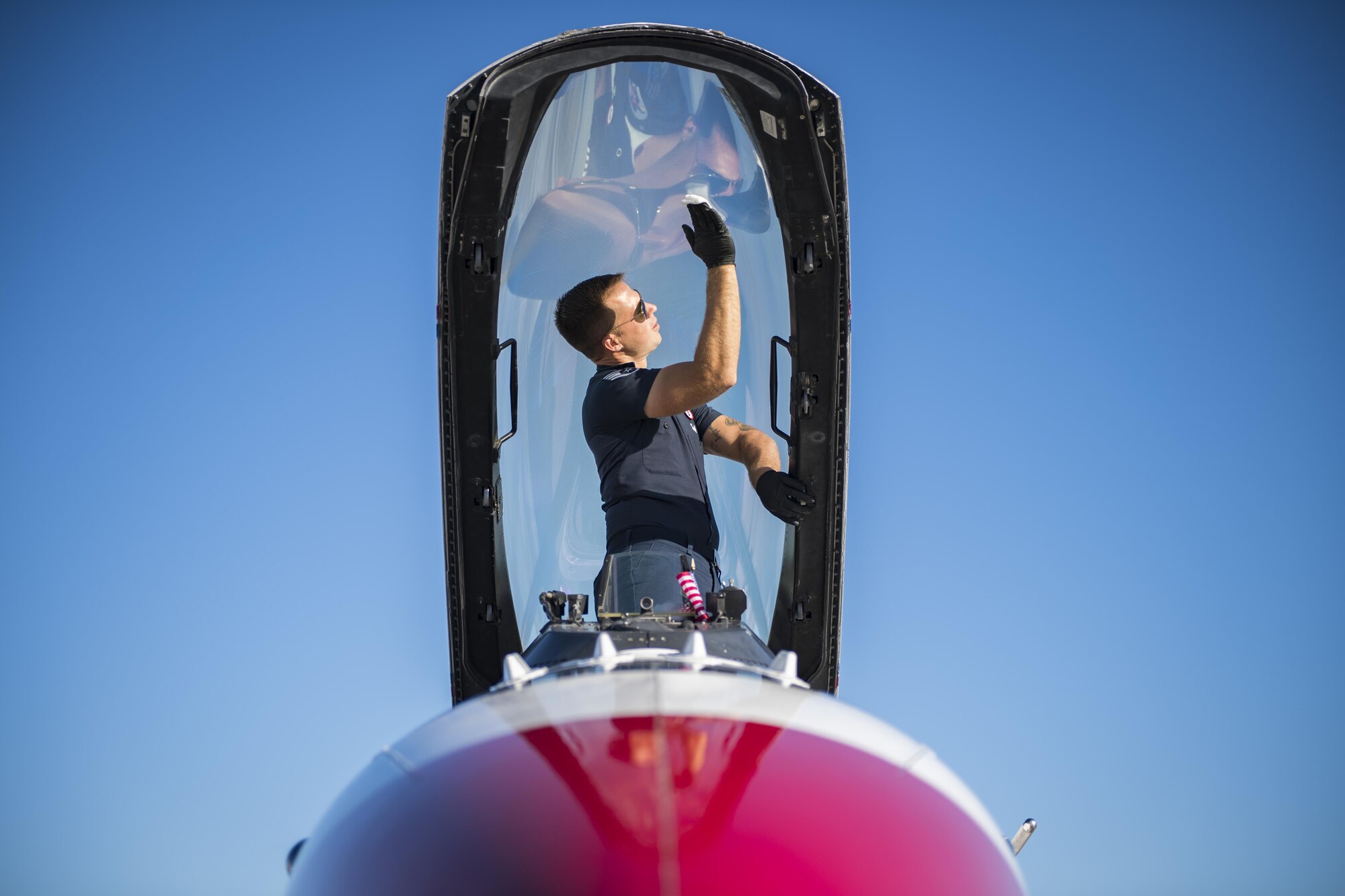Staff Sgt. Kyle Smith, U.S. Air Force Thunderbird No. 3 assistant dedicated crew chief, cleans condensation off a F-16D Fighting Falcon canopy, Oct. 27, 2017, at Moody Air Force Base, Ga. The Thunderbirds, based out of Nellis Air Force Base, Nev., are the Air Force’s premier aerial demonstration team, performing at air shows and special events worldwide. (U.S. Air Force photo by Senior Airman Janiqua P. Robinson)