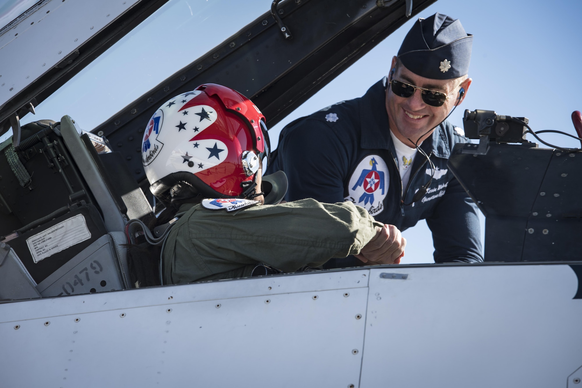 Noelani Mathews, multimedia journalist, shakes hands with Lt. Col. Kevin Walsh, U.S. Air Force Thunderbird pilot No. 7, before her media flight in an F-16D Fighting Falcon, Oct. 27, 2017, at Moody Air Force Base, Ga. The Thunderbirds, based out of Nellis Air Force Base, Nev., are the Air Force’s premier aerial demonstration team, performing at air shows and special events worldwide. (U.S. Air Force photo by Senior Airman Janiqua P. Robinson)