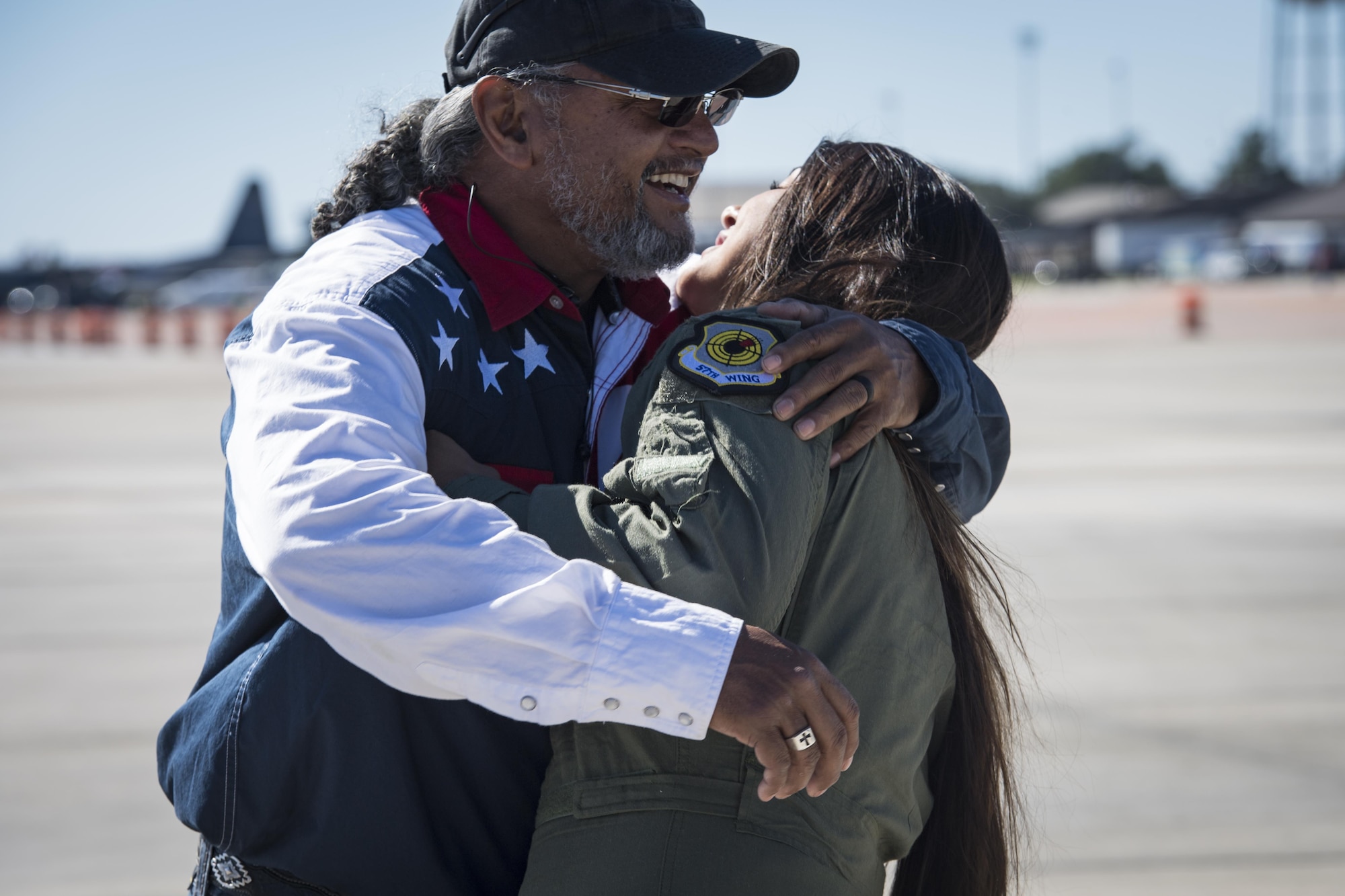 Noelani Mathews, multimedia journalist, hugs her father Ret. Tech. Sgt. Lawrence Mathews, before her media flight in an F-16D Fighting Falcon, Oct. 27, 2017, at Moody Air Force Base, Ga. The U.S. Air Force Thunderbirds, based out of Nellis Air Force Base, Nev., are the Air Force’s premier aerial demonstration team, performing at air shows and special events worldwide. (U.S. Air Force photo by Senior Airman Janiqua P. Robinson)