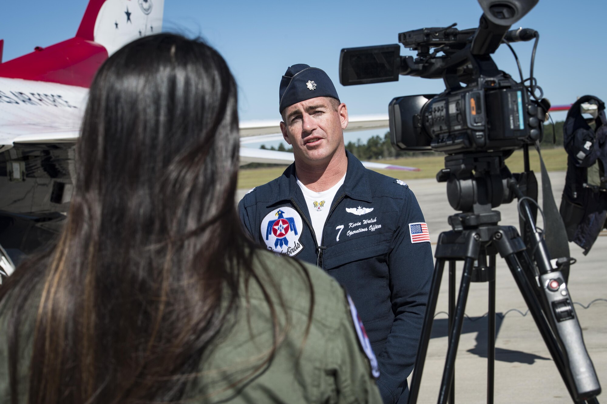 Noelani Mathews, multimedia journalist, interviews Lt. Col. Kevin Walsh, U.S. Air Force Thunderbird pilot No. 7, after her media flight in an F-16D Fighting Falcon, Oct. 27, 2017, at Moody Air Force Base, Ga. The Thunderbirds, based out of Nellis Air Force Base, Nev., are the Air Force’s premier aerial demonstration team, performing at air shows and special events worldwide. (U.S. Air Force photo by Senior Airman Janiqua P. Robinson)