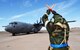 Staff Sgt. William Smith, 317th Aircraft Maintenance Squadron, flying crew chief, marshals a C-130J to a parking spot during the full spectrum readiness sortie