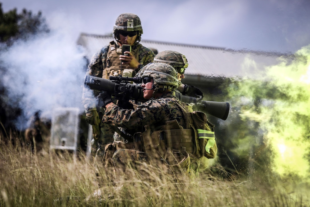 Marines fire a rocket system.