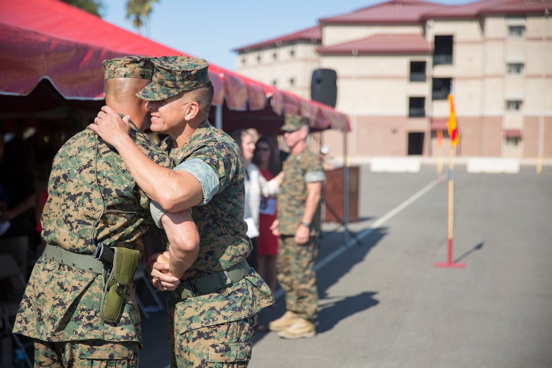 MARINE CORPS BASE CAMP PENDLETON, California - Sgt. Maj. Brandon C. Hall, sergeant major,11th Marine Expeditionary Unit, greets the oncoming commanding officer, Col. Fridrik Fridriksson, during the 11th MEU change of command ceremony aboard Marine Corps Base Camp Pendleton, Oct. 27.  The change of command ceremony is a part of Marine Corps tradition, and signifies the orderly passing of command in honor of good order and discipline. (U.S. Marine Corps photo by Lance Cpl. Jacob A. Farbo)