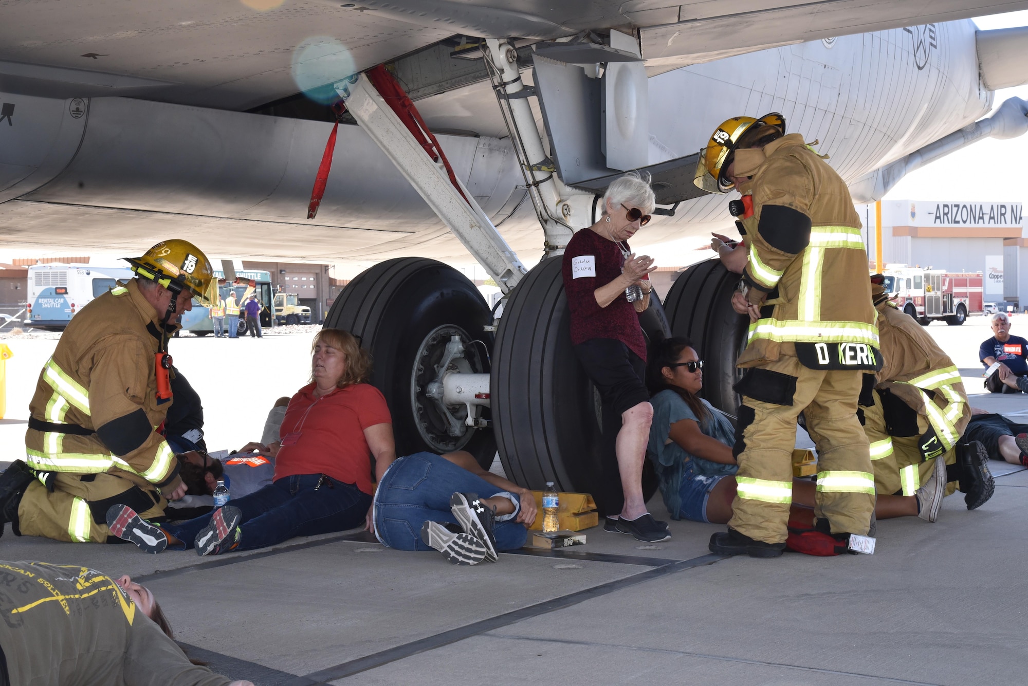 Firemen rush to the aid of passengers immediately after a fictitiously-crashed aircraft here, during the 2017 Triennial Exercise, 26 Oct. 2017. The exercise occurs every three years and the Air Guard participates as one of the partners. (U.S. Air Force photo by 2nd Lt. Tinashe Machona)