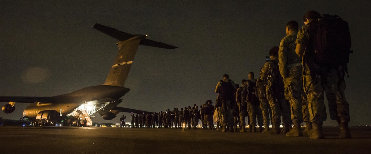 Medical Airmen from the 59th Medical Wing at Joint Base San Antonio-Randolph, Texas prepare to board an aircraft and deploy in support of hurricane relief, September 2017. Air Force Medicine is preparing for future conflicts against new adversaries, with a focus on ensuring all medical forces are ready to deploy as soon as called on. (U.S. Air Force photo by Senior Airman Keifer Bowes)
