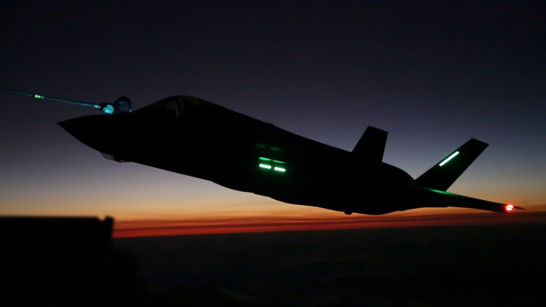 An F-35B Lightning II aircraft with Marine Fighter Attack Squadron (VMFA) 121 based out of Marine Corps Air Station (MCAS) Iwakuni, Japan, conducts a nighttime aerial refueling training operation with a KC-130J Hercules with Marine Aerial Refueler Transport Squadron (VMGR) 152 based out of MCAS Iwakuni Oct. 25, 2017. The training was conducted at night to improve operational readiness and enhance pilot proficiency. (U.S. Marine Corps photo by Lance Cpl. Mason Roy)