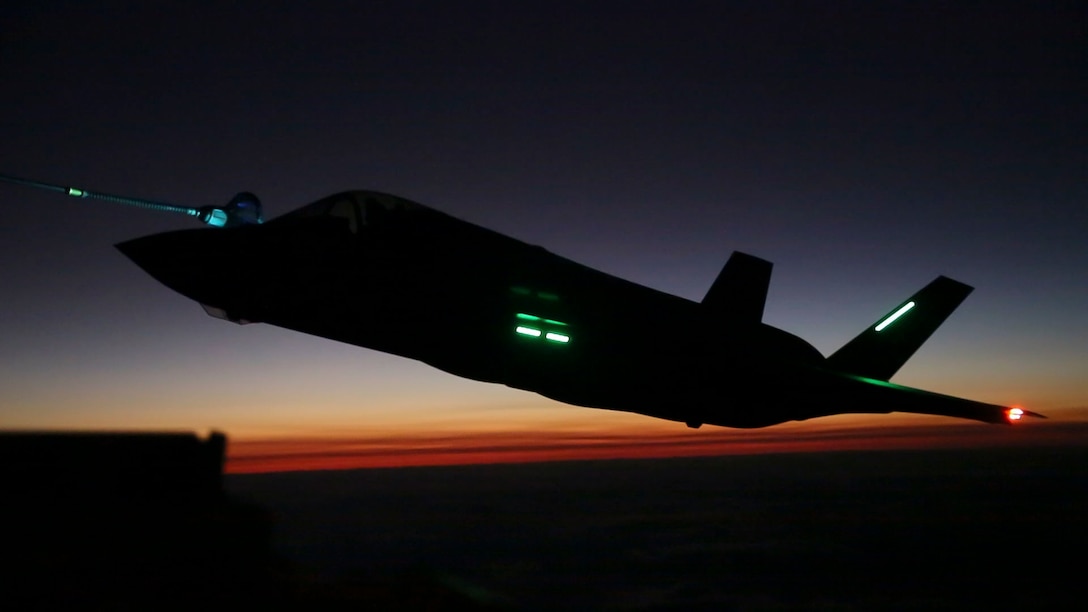 An F-35B Lightning II aircraft with Marine Fighter Attack Squadron (VMFA) 121 based out of Marine Corps Air Station (MCAS) Iwakuni, Japan, conducts a nighttime aerial refueling training operation with a KC-130J Hercules with Marine Aerial Refueler Transport Squadron (VMGR) 152 based out of MCAS Iwakuni Oct. 25, 2017. The training was conducted at night to improve operational readiness and enhance pilot proficiency. (U.S. Marine Corps photo by Lance Cpl. Mason Roy)