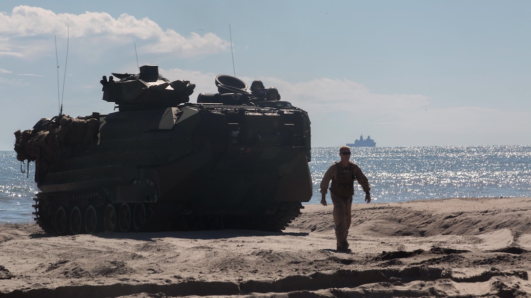A U.S. Amphibious Assault Vehicle is guided onshore during exercise Bold Alligator 17 at Camp Lejeune, N.C., Oct. 25, 2017.  Bold Alligator 17 is a multinational, naval amphibious exercise that focuses on combined training of multiple forces executing complex shaping, amphibious, and sea basing operations to improve U.S. and coalition ship-to-shore capabilities.