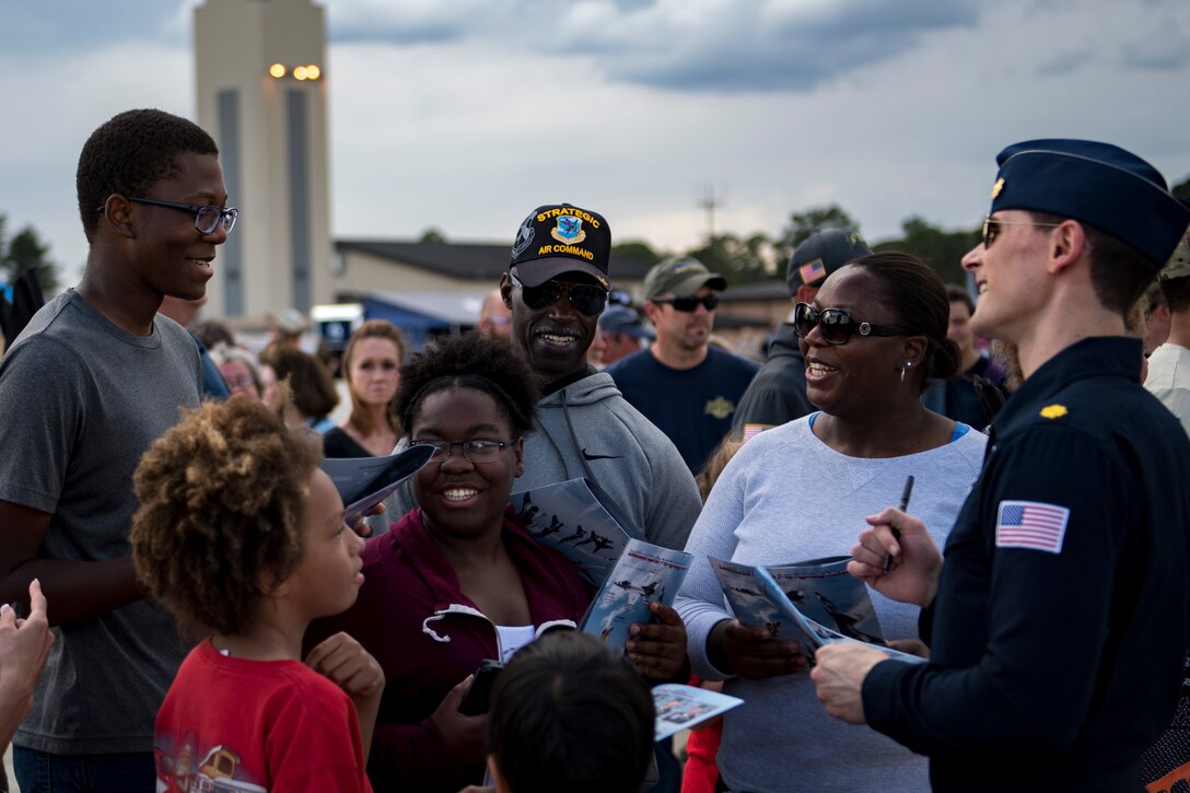 A pilot assigned to The U.S. Air Force Thunderbirds Flight Demonstration Team signs autographs and meets the crowd during the Thunder Over South Georgia Air Show, Oct. 28, 2017, at Moody Air Force Base, Ga. The Thunderbirds, based out of Nellis Air Force Base, Nev., are the Air Force’s premier aerial demonstration team, performing at air shows and special events worldwide. (U.S. Air Force photo by Senior Airman Daniel Snider)