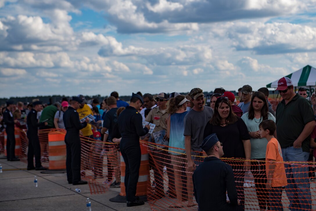 Pilots assigned to The U.S. Air Force Thunderbirds Flight Demonstration Team sign autographs and meet the crowd during the Thunder Over South Georgia Air Show, Oct. 28, 2017, at Moody Air Force Base, Ga. The Thunderbirds, based out of Nellis Air Force Base, Nev., are the Air Force’s premier aerial demonstration team, performing at air shows and special events worldwide. (U.S. Air Force photo by Senior Airman Daniel Snider)