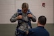 Senior Airman Jordan Rodriguez, 23d Medical Support Squadron medical lab technician, dons equipment used in a tandem free-fall jump during Thunder Over South Georgia, Oct. 28, 2017, at Moody Air Force Base, Ga. This jump was led held by the Wings of Blue parachute team from the U.S. Air Force Academy. (U.S. Air Force photo by Senior Airman Daniel Snider)