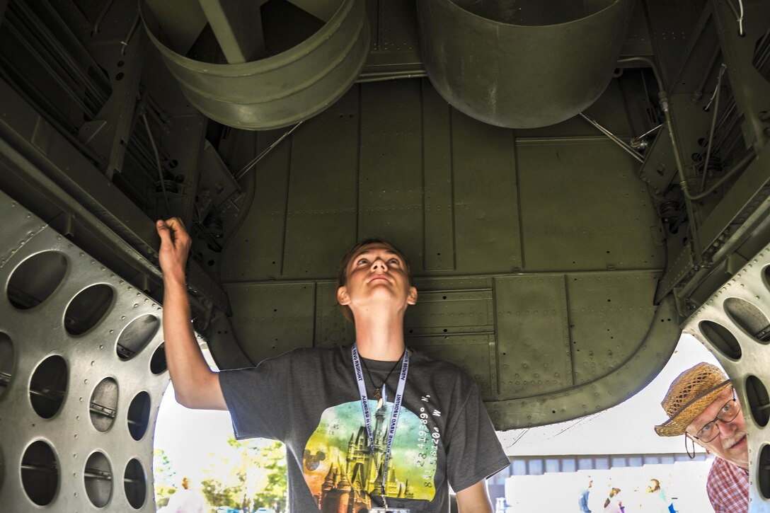 Tommy Richter, P-52 presenter, observes the motors on an aircraft during the Thunder Over South Georgia Air Show, Oct. 28, 2017, at Moody Air Force Base, Ga. Moody opened its gates to the public for a free, two-day event as a way to thank the local community for their ongoing support of the base’s mission. (U.S. Air Force photo by Airman Eugene Oliver)