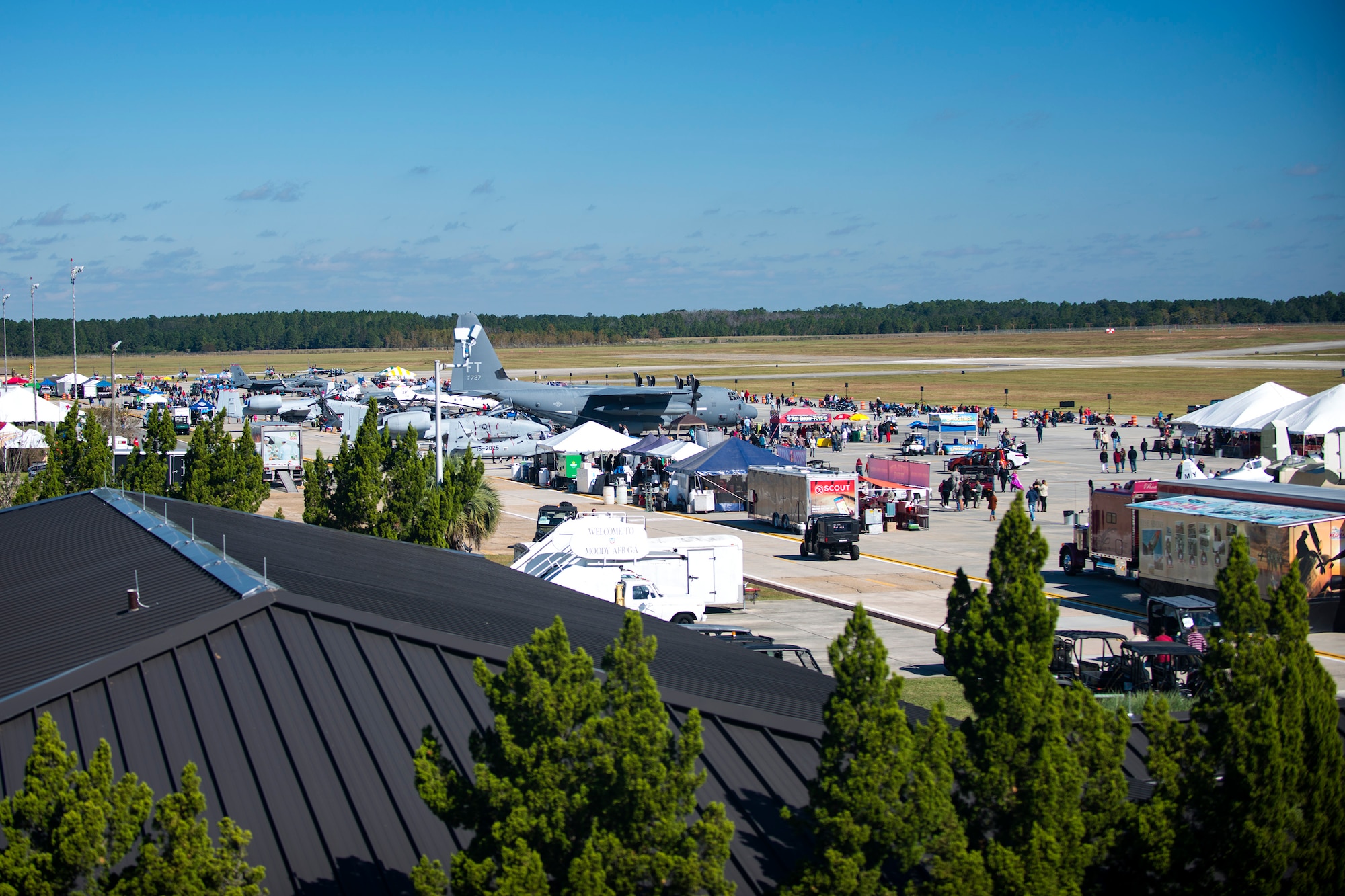 Spectators walk around and view the different attractions available the Thunder Over South Georgia Air Show, Oct. 29, 2017, at Moody Air Force Base, Ga. Throughout the show, guests viewed aircraft through the ages perform such as the P-51 mustang, a World War II fighter, and the Moody’s own A-10C Thunderbolt IIs. (U.S. Air Force photo by Airman 1st Class Erick Requadt)