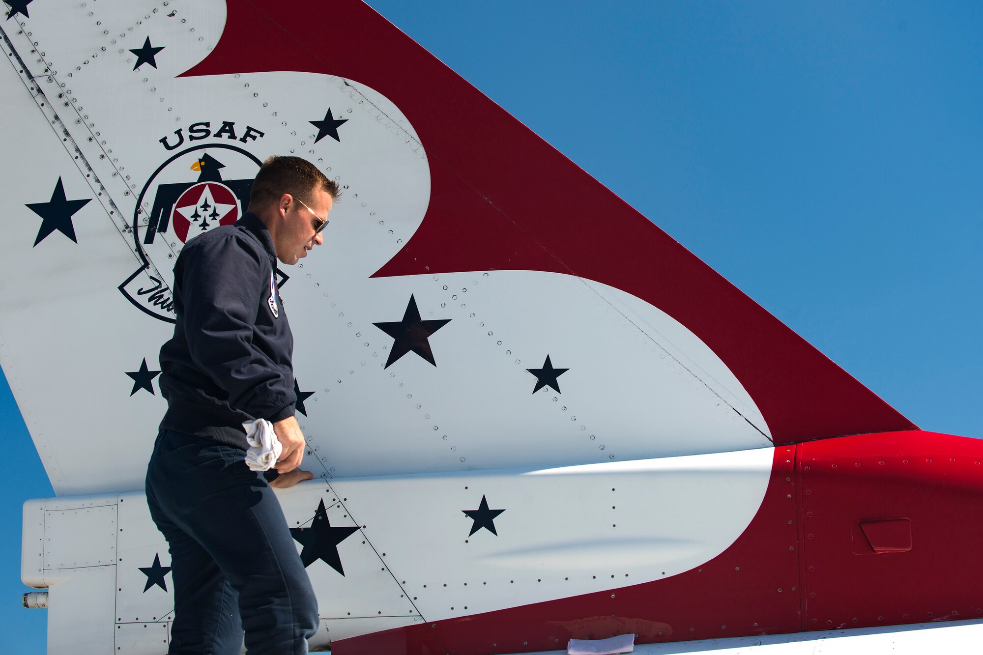 A U.S. Air Force Thunderbird maintainer cleans an F-16C Fighting Falcon during the Thunder Over South Georgia Air Show, Oct. 29, 2017, at Moody Air Force Base, Ga. The Thunderbirds, based out of Nellis Air Force Base, Nev., are the Air Force’s premier aerial demonstration team, performing at air shows and special events worldwide. (U.S. Air Force photo by Airman 1st Class Erick Requadt)