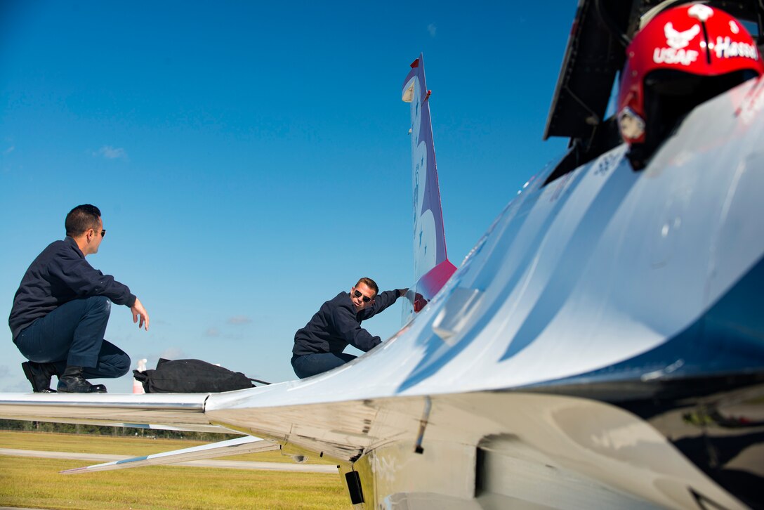 Two U.S. Air Force Thunderbird maintainers clean an F-16C Fighting Falcon during the Thunder Over South Georgia Air Show, Oct. 29, 2017, at Moody Air Force Base, Ga. The Thunderbirds, based out of Nellis Air Force Base, Nev., are the Air Force’s premier aerial demonstration team, performing at air shows and special events worldwide. (U.S. Air Force photo by Airman 1st Class Erick Requadt)