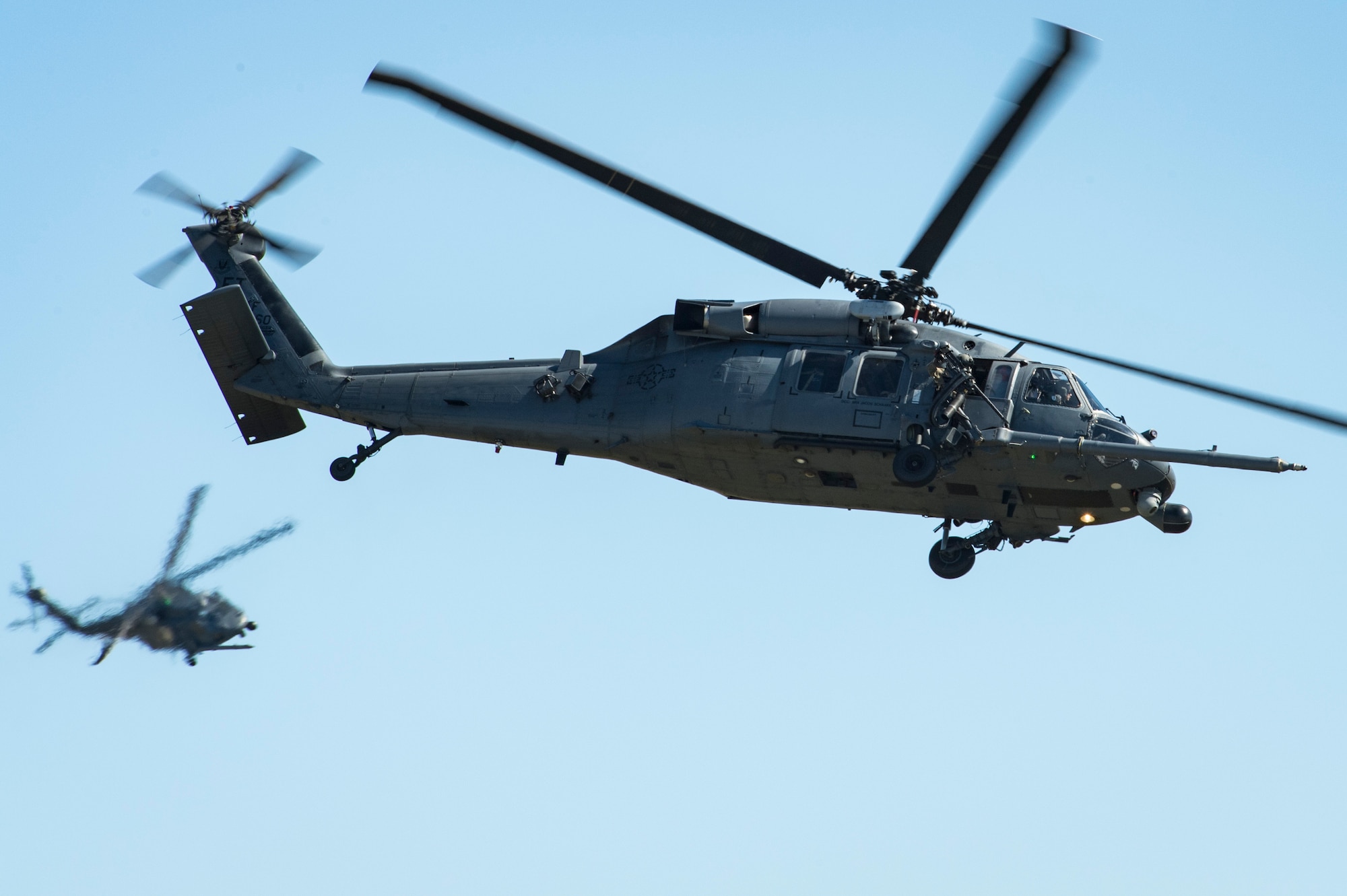 Two HH-60G Pave Hawks from the 41st Rescue Squadron fly over Moody Air Force Base, Ga. during the Thunder Over South Georgia Air Show, Oct. 28. The open house is an opportunity for Moody to thank the local community for all its support, and exhibit air power and it included aerial performances, food, face painting and much more. (U.S. Air Force photo by Senior Airman Janiqua Robinson)