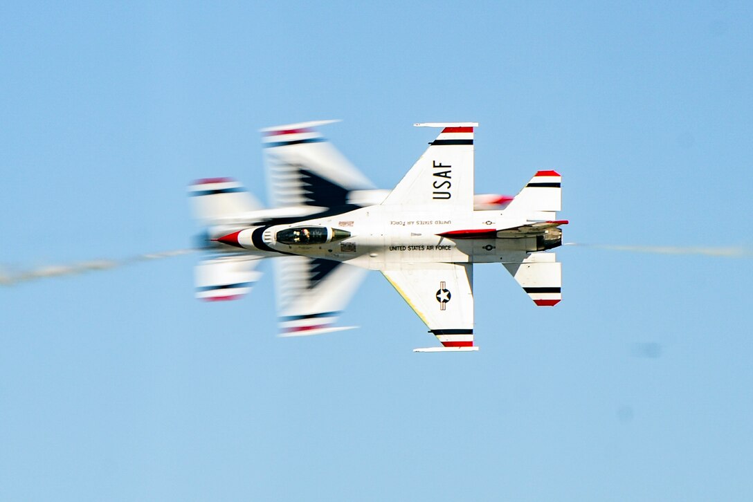 Two U.S. Air Force Thunderbirds F-16 Fighting Falcons perform an aerial demonstration during the Thunder Over South Georgia Air Show, Oct. 29, 2017 at Moody Air Force Base, Ga. The Thunderbirds performed twists, turns and rolls at high speeds demonstrating the prowess and capabilities of the F-16 Fighting Falcon. (U.S. Air Force photo by Airman Eugene Oliver)