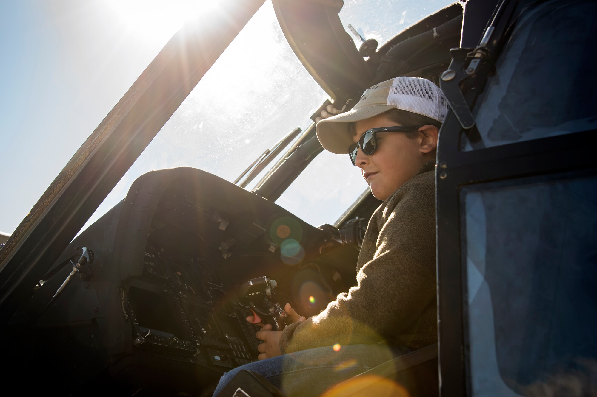 Ryan Lawton, local community member, grabs the throttle of a HH-60G Pave Hawk during the Thunder Over South Georgia Air Show, Oct. 29, 2017 at Moody Air Force Base, Ga. Moody opened its gates to the public for a free, two-day event as a way to thank the local community for their ongoing support of the base’s mission. (U.S. Air Force photo by Airman Eugene Oliver)