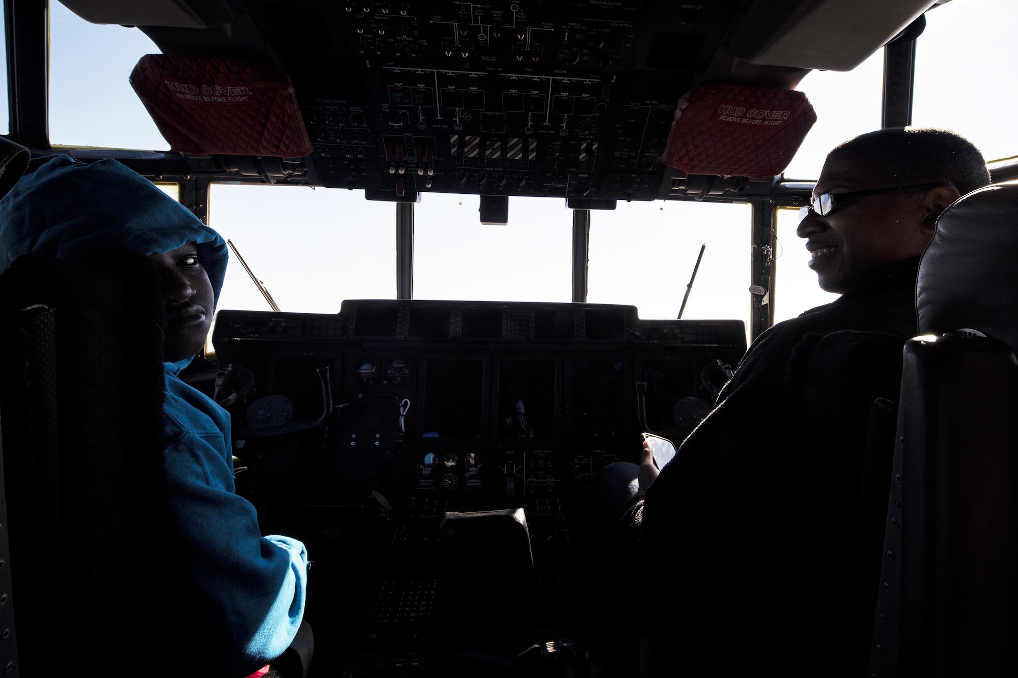 Paul Collier, local community member, and his son, Xavion, sit in the cockpit of a HC-130J Combat King during the Thunder Over South Georgia Air Show, Oct. 29,2017 at Moody Air Force Base, Ga. Moody opened its gates to the public for a free, two-day event as a way to thank the local community for their ongoing support of the base’s mission (U.S. Air Force photo by Airman Eugene Oliver)