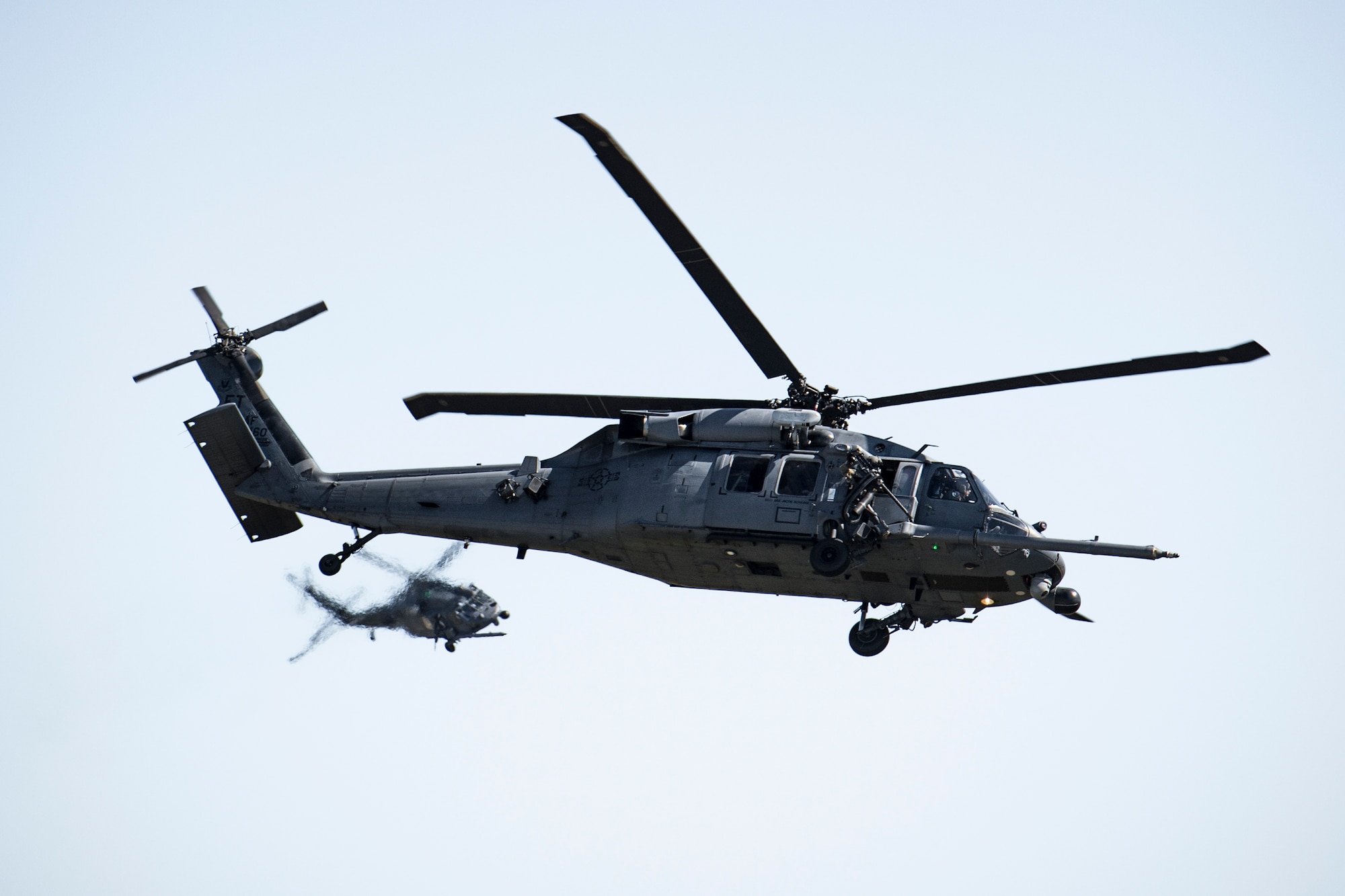 Two HH-60G Pave Hawks from the 41st Rescue Squadron fly during the Thunder Over South Georgia Air Show, Oct. 29, 2017, at Moody Air Force Base, Ga. The open house is an opportunity for Moody to thank the local community for all its support, and exhibit air power and it included aerial performances, food, face painting and much more. (U.S. Air Force photo by Staff Sgt. Ryan Callaghan)