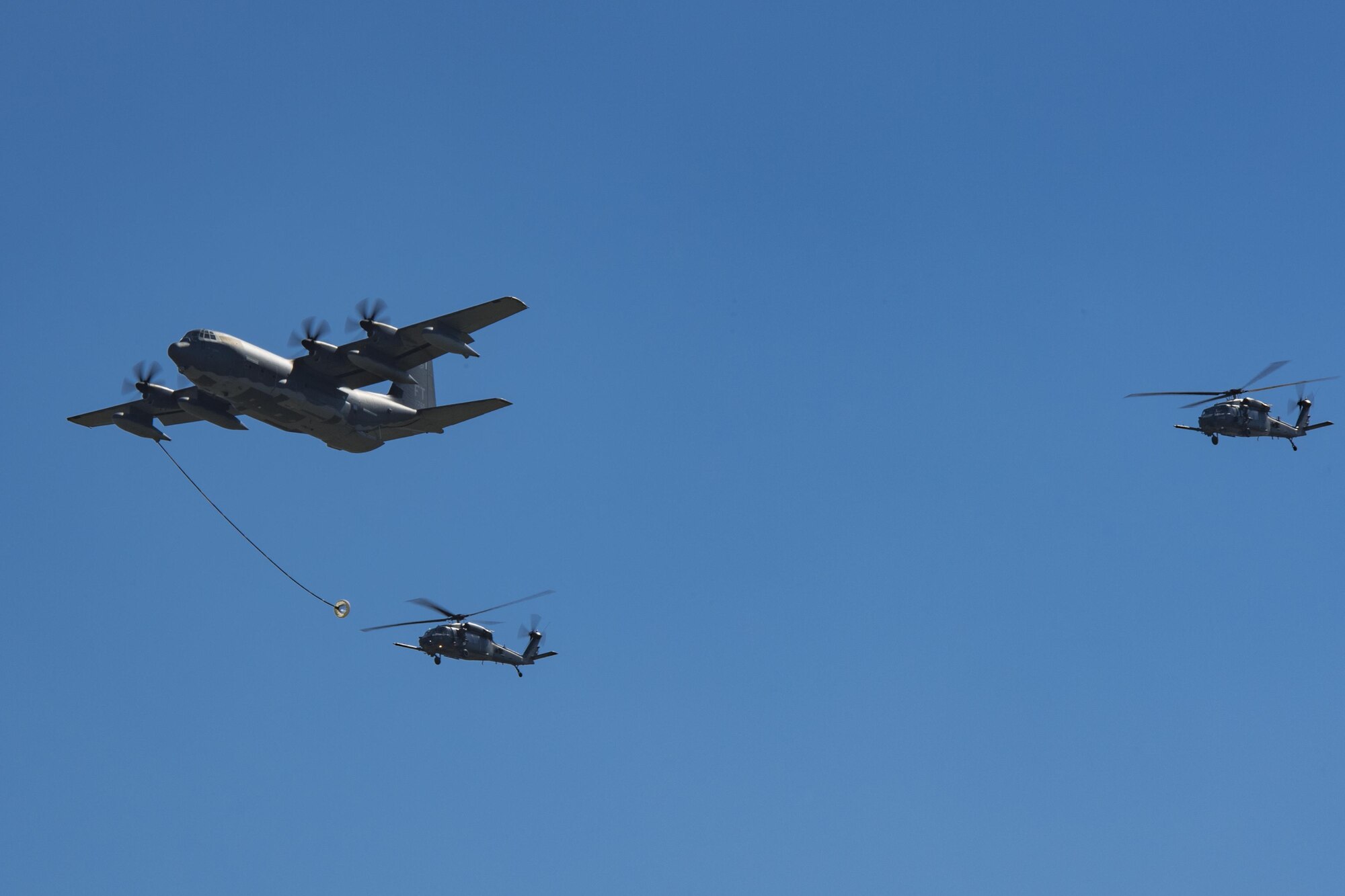 HC-130J Combat King II and two HH-60G Pavehawks demonstrate its capabilities during the Thunder Over South Georgia Air Show, Oct. 29, 2017, at Moody Air Force Base, Ga. The open house included aerial performances, food, face painting and much more. (U.S. Air Force photo by Staff Sgt, Eric Summers Jr.)