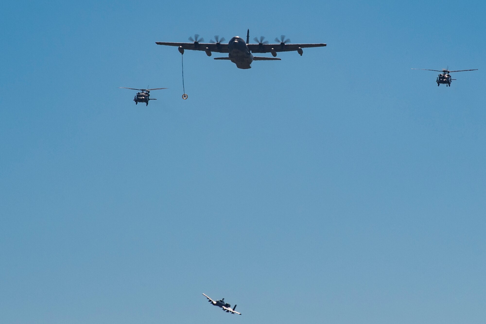 HC-130J Combat King II and two HH-60G Pavehawks demonstrate its capabilities during the Thunder Over South Georgia Air Show, Oct. 29, 2017, at Moody Air Force Base, Ga. The open house included aerial performances, food, face painting and much more. (U.S. Air Force photo by Staff Sgt, Eric Summers Jr.)