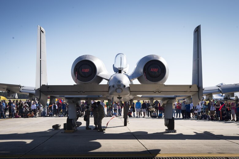 Airmen from the 23d Maintenance Group perform a weapons load demonstration in front of a crowd of spectators, during Thunder Over South Georgia, Oct. 28, 2017, at Moody Air Force Base, Ga.In addition to aerial events, the air show also provided a unique opportunity to educate the public on past and present Air Force capabilities, increase recruiting and show appreciation to the local community. (U.S. Air Force photo by Andrea Jenkins)