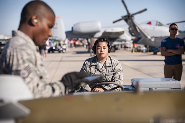 Airmen from the 23d Maintenance Group perform a weapons load demonstration in front of a crowd of spectators, during Thunder Over South Georgia, Oct. 28, 2017, at Moody Air Force Base, Ga.In addition to aerial events, the airshow also provided a unique opportunity to educate the public on past and present Air Force capabilities, increase recruiting and show appreciation to the local community. (U.S. Air Force photo by Andrea Jenkins)