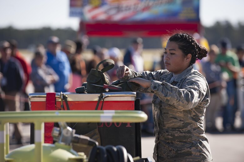 Airmen from the 23d Maintenance Group perform a weapons load demonstration in front of a crowd of spectators, during Thunder Over South Georgia Air and Space Expo, Oct. 28, 2017, at Moody Air Force Base, Ga.In addition to aerial events, the air show also provided a unique opportunity to educate the public on past and present Air Force capabilities, increase recruiting and show appreciation to the local community. (U.S. Air Force photo by Andrea Jenkins)