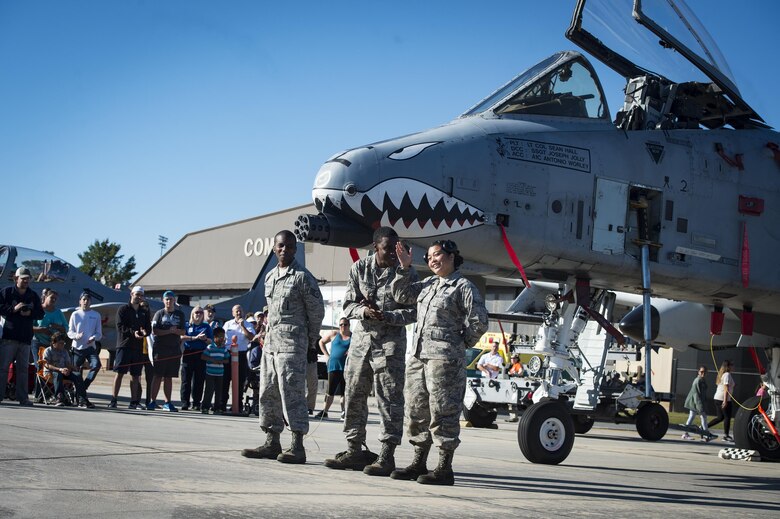 Airmen from the 23d Maintenance Group perform a weapons load demonstration in front of a crowd of spectators, during Thunder Over South Georgia, Oct. 28, 2017, at Moody Air Force Base, Ga.In addition to aerial events, the air show also provided a unique opportunity to educate the public on past and present Air Force capabilities, increase recruiting and show appreciation to the local community. (U.S. Air Force Staff Sgt. Ceaira Young)