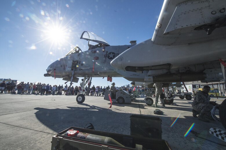 Airmen from the 23d Maintenance Group perform a weapons load demonstration in front of a crowd of spectators, during Thunder Over South Georgia Air and Space Expo, Oct. 28, 2017, at Moody Air Force Base, Ga.In addition to aerial events, the air show also provided a unique opportunity to educate the public on past and present Air Force capabilities, increase recruiting and show appreciation to the local community. (U.S. Air Force Staff Sgt. Ceaira Young)