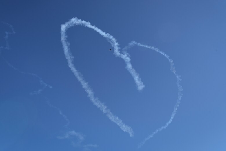 A F-16 Fighting Falcon leaves behind a heart-shaped trail of smoke during the Thunder Over South Georgia Air Show, Oct. 29, 2017, at Moody Air Force Base, Ga. The Thunderbirds’ demonstration consisted of many formation and solo flying routines including the calypso pass, reflection pass, arrowhead loop, cross over break, delta burst, diamond opener, high bomb burst and inverted opposing knife edge. (U.S. Air Force photo by Senior Airman Greg Nash)