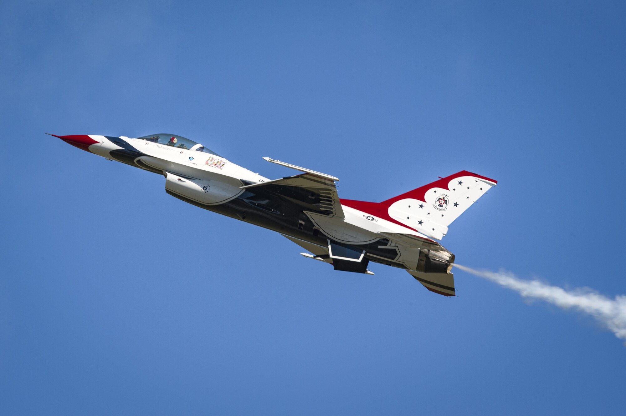 A member of the U.S. Air Force Thunderbirds Flight Demonstration Team soars above 11,000 spectators during the 2017 Thunder Over South Georgia Air Show, Oct. 29, 2017, at Moody Air Force Base, Ga. In addition to aerial performances by military and civilian pilots, attendees viewed aircraft through the ages perform such as the P-51 mustang, a World War II fighter, and Moody’s own A-10C Thunderbolt IIs, HH-60 G Pave Hawks and HC-130J Combat King IIs. (U.S. Air Force photo by Senior Airman Greg Nash)