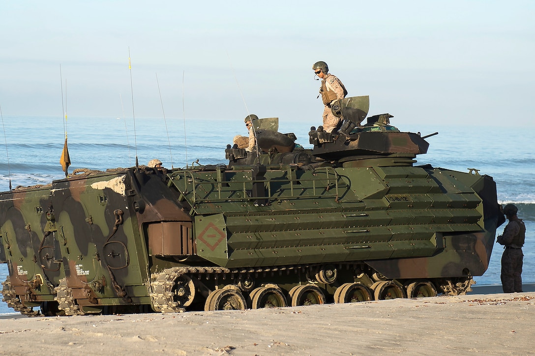 Marines participating in bilateral exercise Dawn Blitz 2017 exit an amphibious assault vehicle on Red Beach.