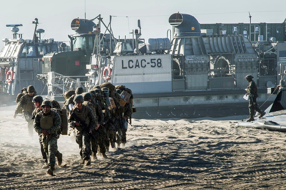 Marines offload an air-cushion landing craft before participating in tactical maneuvers on Red Beach.