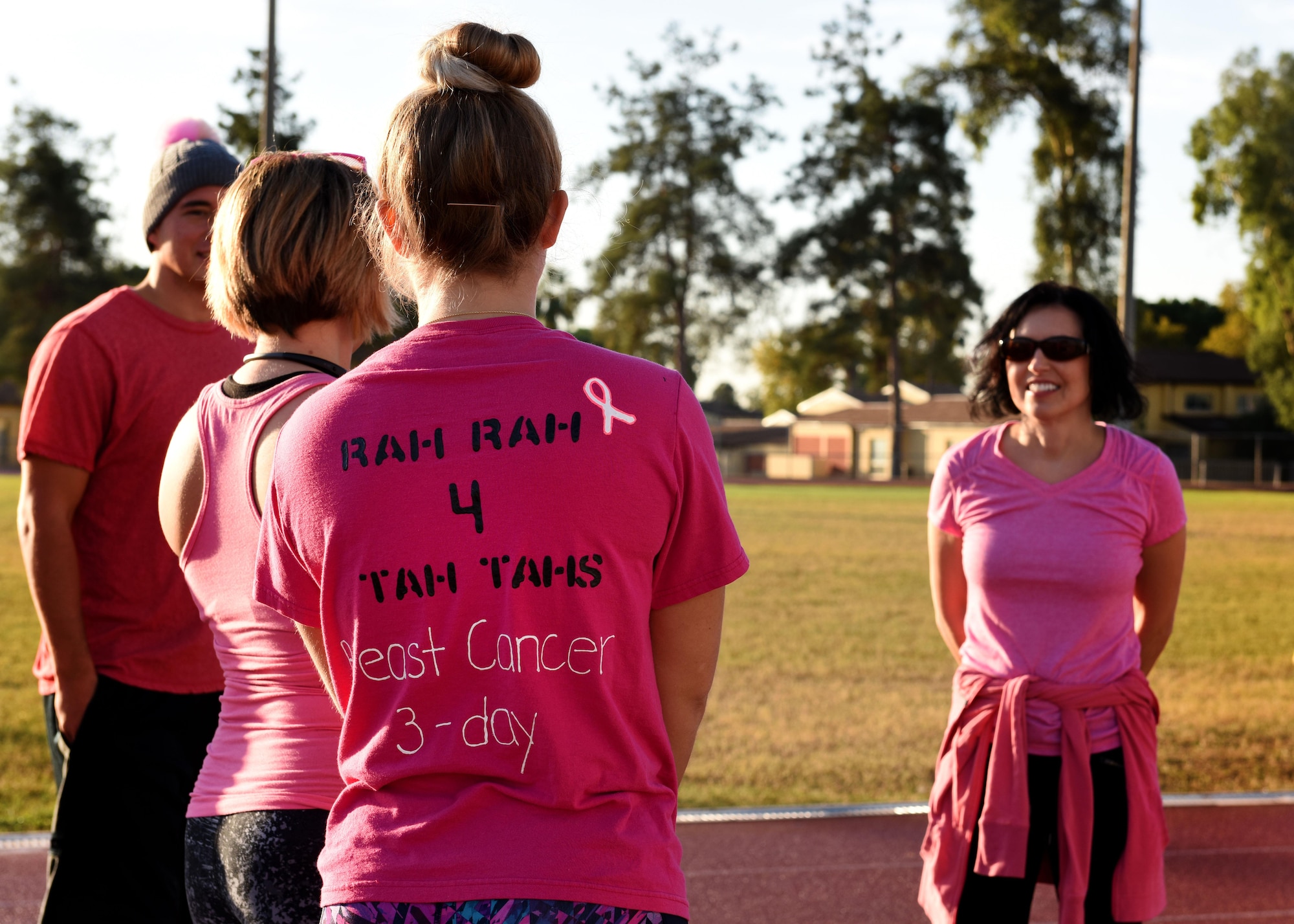 Participants gather at the track before a breast cancer awareness walk-a-thon at Incirlik AB, Turkey, Oct. 27, 2017. Walkers were encouraged to wear pink, which is the chosen color for this cause. (U.S. Air Force photo by Staff Sgt. Rebeccah Woodrow)