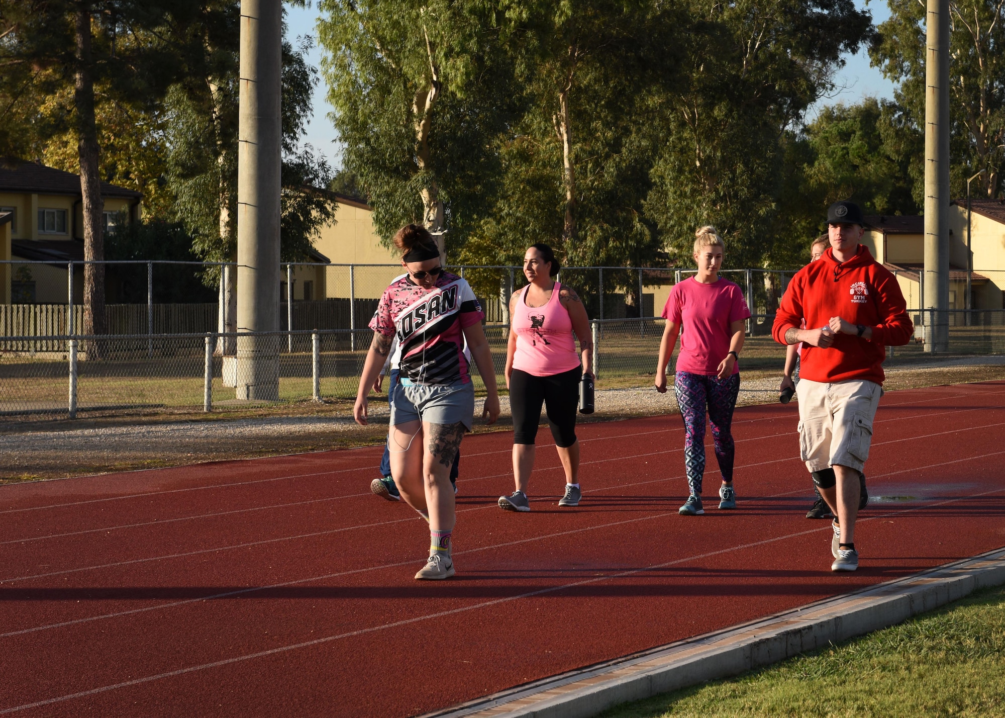 Base members walk around the track for two hours in support of a breast cancer awareness walk-a-thon at Incirlik AB, Turkey, Oct. 27, 2017. October is nationally known as Breast Cancer Awareness month and is meant to bring attention to the need for cancer research and early cancer prevention. (U.S. Air Force photo by Staff Sgt. Rebeccah Woodrow)
