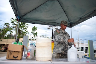 Soldiers purify river water using a tactical water purification unit in Campo Rico, Puerto Rico, Oct. 28, 2017. Photos by Air Force Airman 1st Class Nicholas Dutton