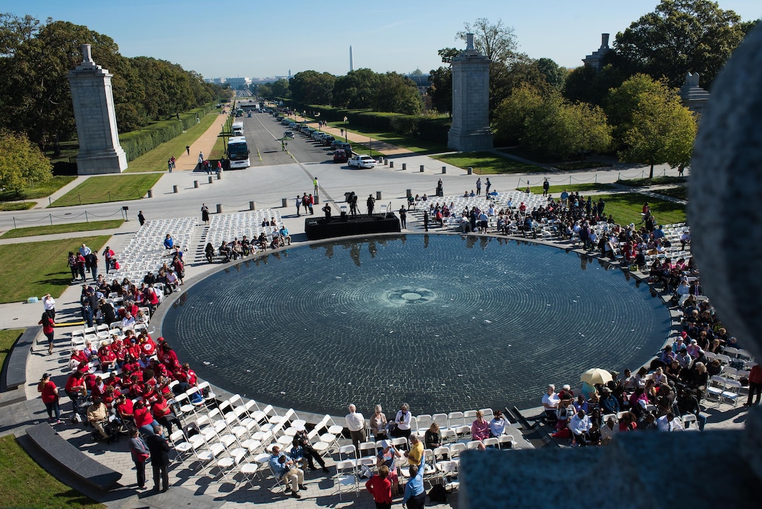 Crowds begin to gather in the morning light at the Women in Military Service for America Memorial, the ceremonial entrance to Arlington National Cemetery in Washington D.C. for the 20th anniversary ceremony, Oct. 21, 2017. Nearly 40 Oklahoma Air and Army National Guard women gathered with hundreds of active-duty, retired and reserve servicewomen from all branches of the military to celebrate the 20th anniversary of the dedication of the memorial to honor the women who came before them and celebrate the opportunities that are still to come. (U.S. Air National Guard photo by Staff Sgt. Kasey Phipps)