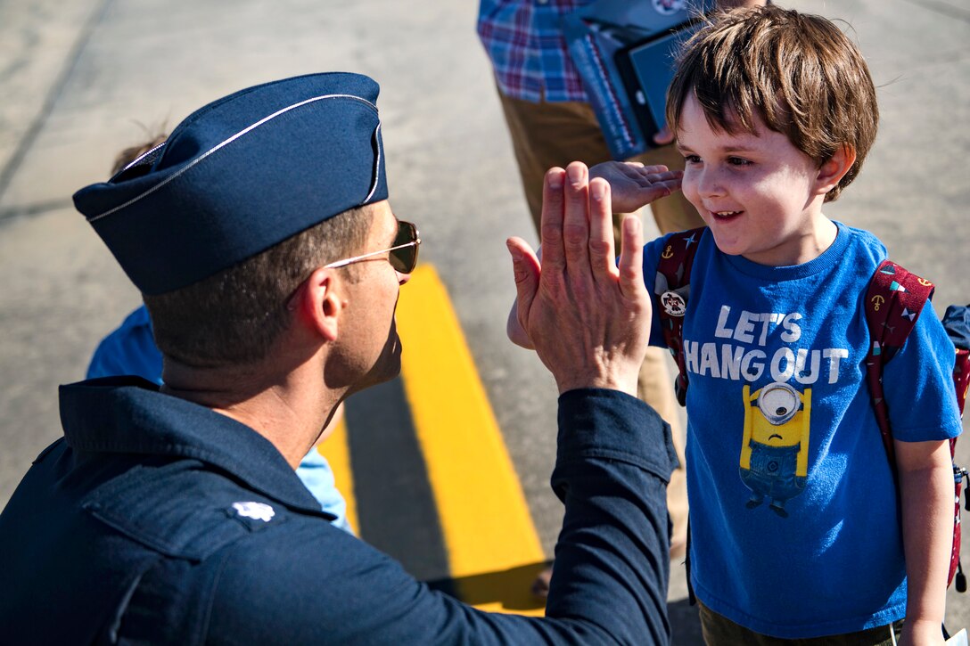 A Thunderbird pilot interacts with a young fan, during Thunder Over South Georgia.