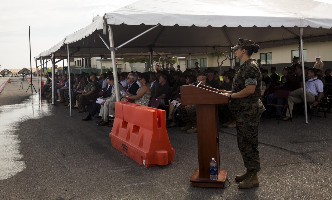 Staff Sgt. Nicki Dunn, an aviation operation specialist assigned to Marine Aircraft Group (MAG) 13, narrates the MAG-13 change of command ceremony on the flightline at Marine Corps Air Station Yuma, Ariz., July 28, 2017. Col. Marcus B. Annibale, the outgoing commanding officer of MAG-13, relinquished command to the oncoming commanding officer, Col. William R. Sauerland. (U.S. Marine Corps photo taken by Pfc. Sabrina Candiaflores)
