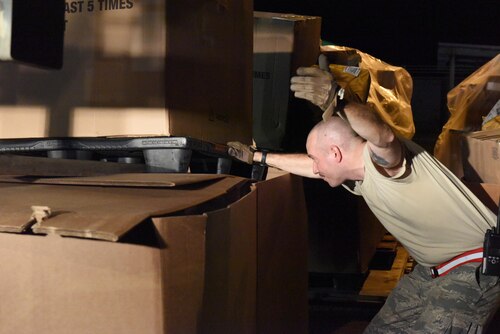 Tech. Sgt. Michael Mungavin, a member of the 103rd Logistics Readiness Squadron, directs a forklift operator loading pallets of U.S. mail on trucks for the United States Postal Service at Muñiz Air National Guard Base, Puerto Rico, Oct. 20. Power outages and a large influx of care packages and relief items from around the world have quadrupled the average volume of mail destined to the Caribbean island still in recovery from Hurricane Maria. (U.S. Air National Guard photo by Staff Sgt. Angel Oquendo)