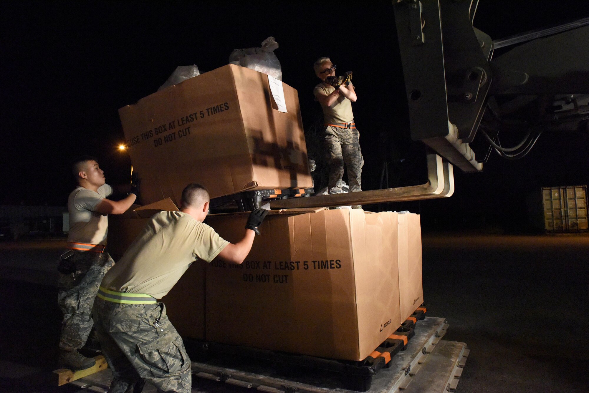 Aerial Port Airmen from Alaska's Air National Guard's 176th Airlift Wing, Connecticut ANG's 103rd Airlift Wing and the Puerto Rico ANG's 156th Airlift Wing work together to load 18 pallets of U.S. mail on trucks for the United States Postal Service at Muñiz Air National Guard Base, Puerto Rico, Oct. 20. Power outages and a large influx of care packages and relief items from around the world have quadrupled the average volume of mail destined to the Caribbean island still in recovery from Hurricane Maria. (U.S. Air National Guard photo by Staff Sgt. Angel Oquendo)