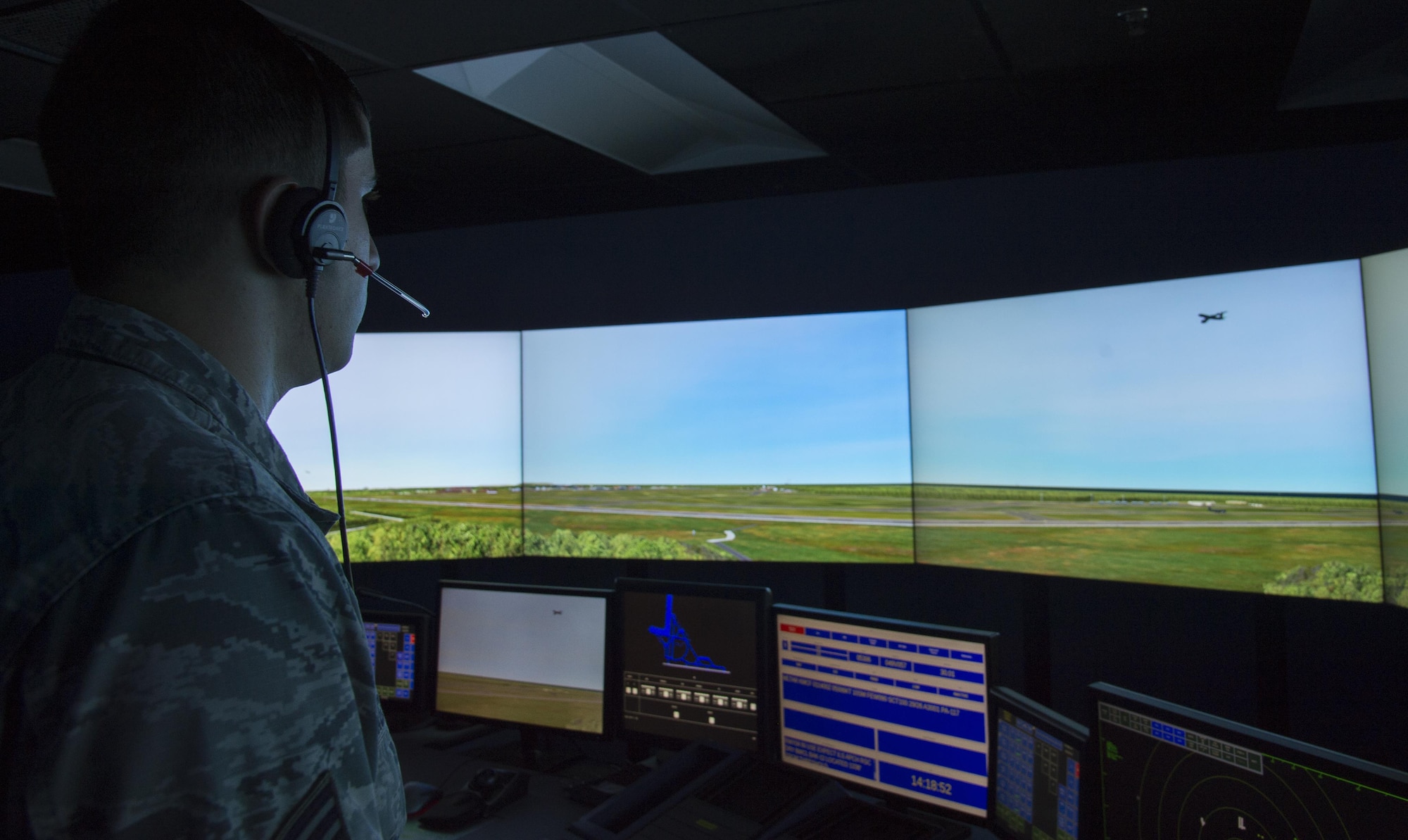 U.S. Air Force Senior Airman Vincent Magenti, an air traffic controller assigned to the 6th Operations Support Squadron, tracks an aircraft flying into the MacDill air space during a training scenario in the simulator at MacDill Air Force Base, Fla., Oct. 27, 2017. Air traffic controllers are responsible for monitoring the air space to keep missions running safely and effectively. (U.S. Air Force photo by Senior Airman Mariette Adams)