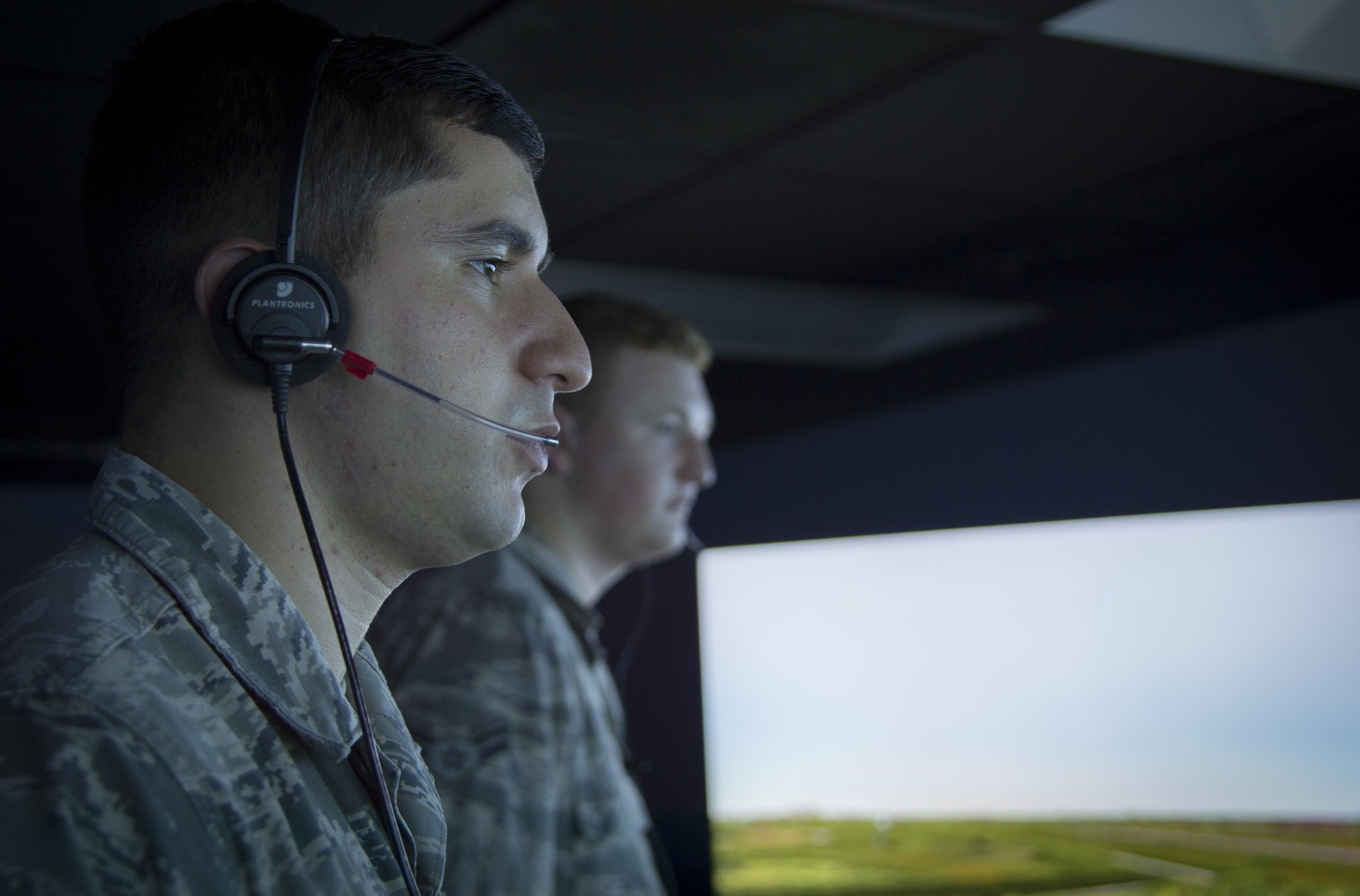 U.S. Air Force Senior Airman Vincent Magenti, an air traffic controller assigned to the 6th Operations Support Squadron, communicates to simulated pilots during an air traffic control simulator scenario at MacDill Air Force Base, Fla., Oct. 27, 2017. The simulator uses a replicated MacDill air field layout, voice recognition technology and customized scenarios to give controllers a realistic environments. (U.S. Air Force photo by Senior Airman Mariette Adams)