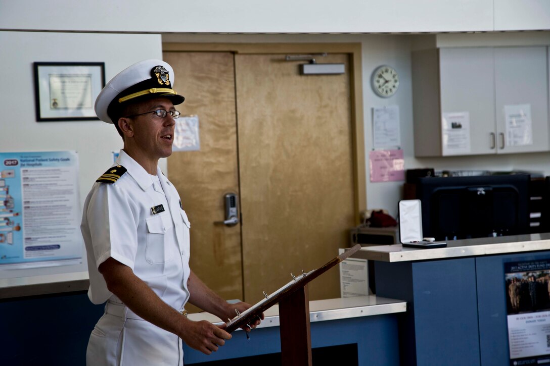 U.S. Navy Lt. Cmdr. Samuel H. Jarvis, the oncoming Branch Health Clinic Yuma commander speaks to the audience during his Change of Charge ceremony at Marine Corps Air Station Yuma Ariz., July 13, 2017. (U.S. Marine Corps photo by Lance Cpl. Joel Soriano)