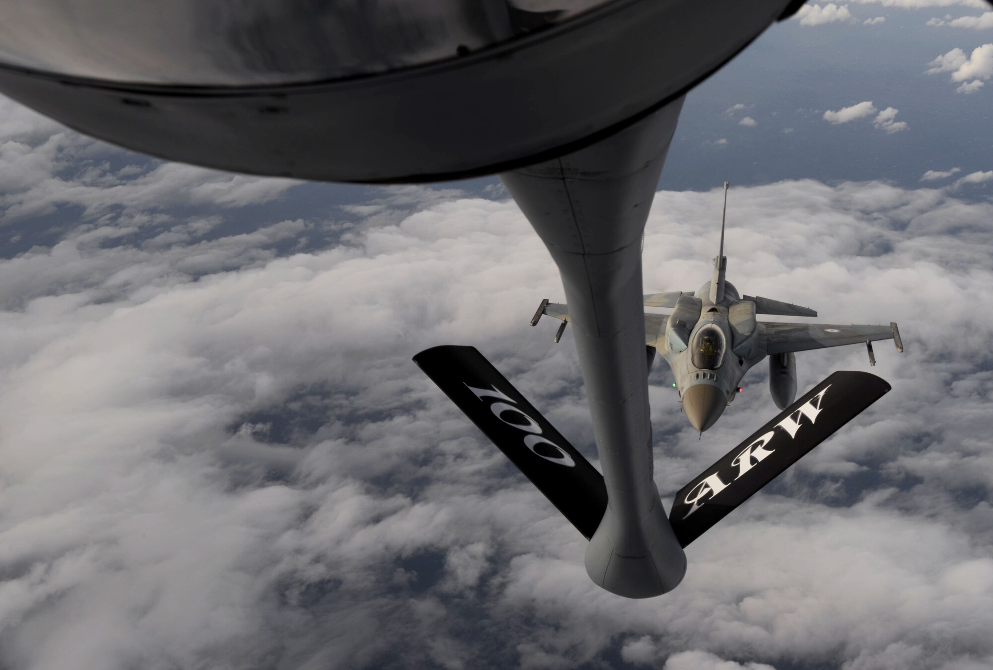 Hellenic air force F-16D Fighting Falcons fly alongside a U.S. Air Force KC-135 Stratotanker from the 100th Air Refueling Wing Oct. 26, 2017, over the Mediterranean Sea. During this flight, the KC-135 participated in aerial refueling training with 22 F-16s. (U.S. Air Force photo by Senior Airman Tenley Long)