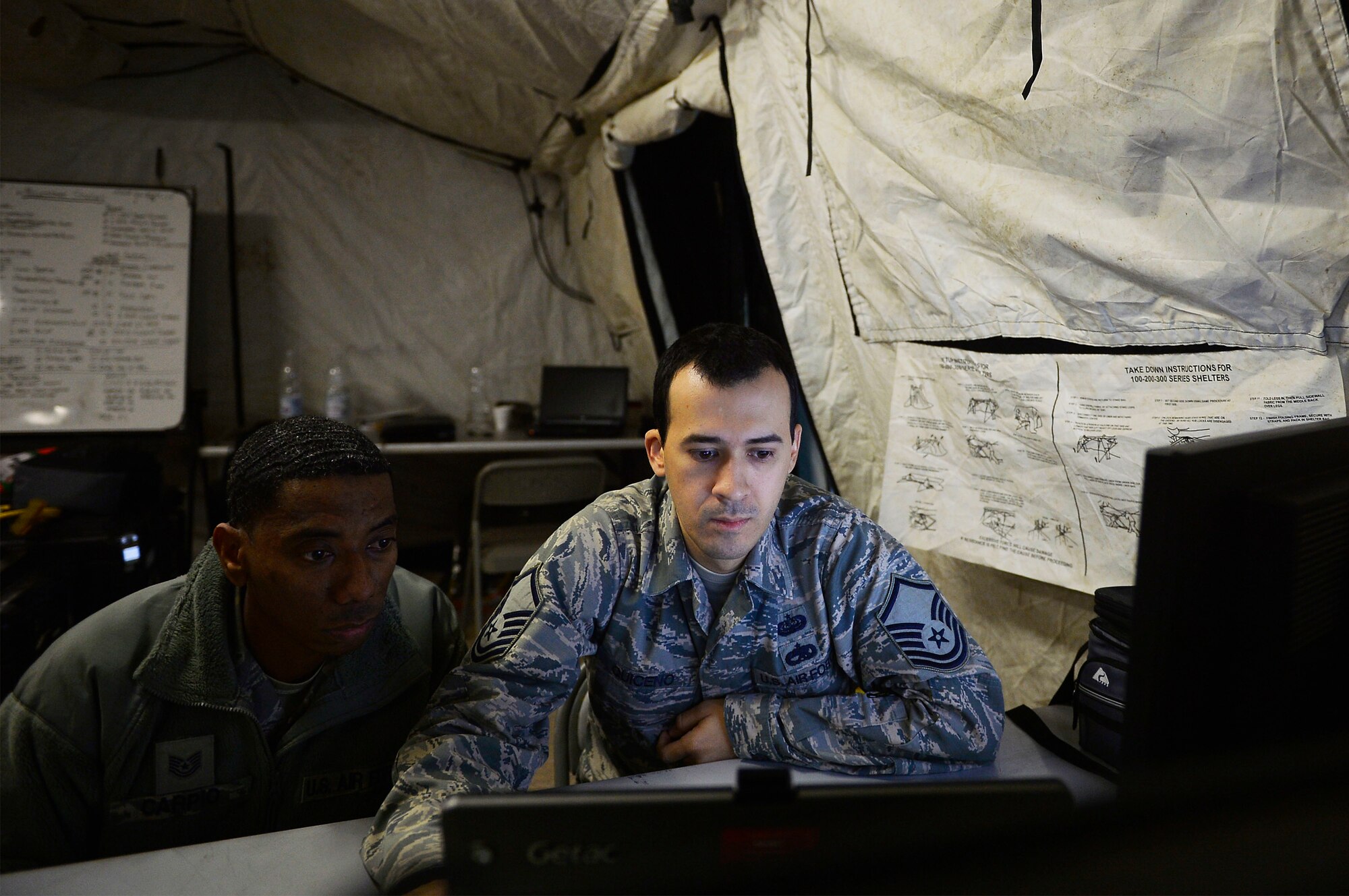 Airmen assigned to the 1st Combat Communications Squadron troubleshoot a network during an exercise on Rhine Ordnance Barracks, Germany, Oct. 26, 2017. The exercise saw participation from both the U.S. Air Force and U.S. Army. (U.S. Air Force photo by Airman 1st Class Joshua Magbanua)