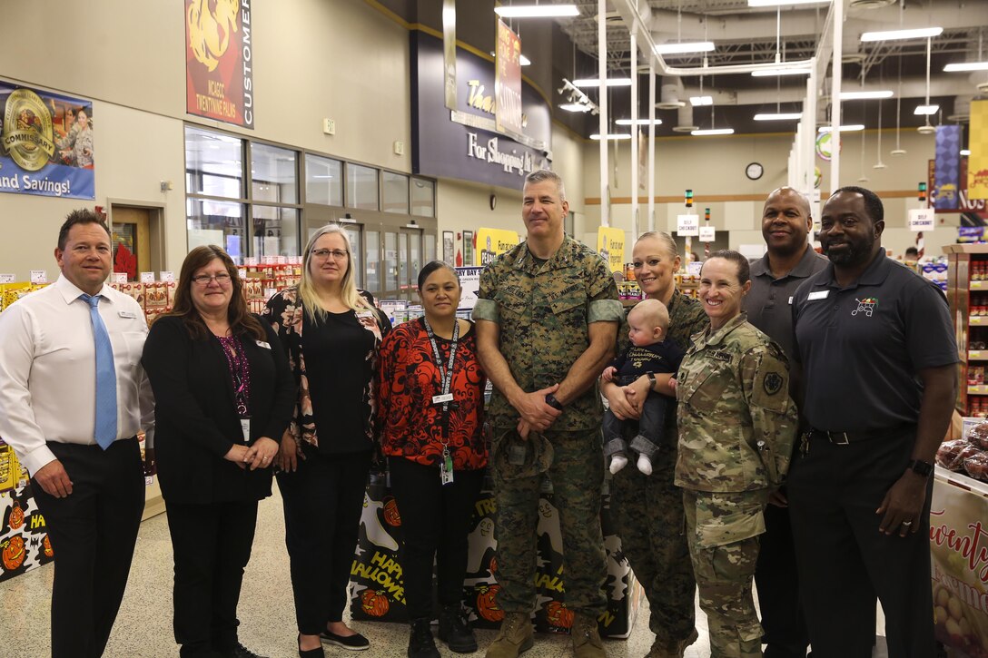 Marine Corps Air Ground Combat Center Commanding General Maj. Gen. William F. Mullen III poses with Commissary and installation staff members during the reopening Oct.21, 2017. The command and DeCA worked diligently to restore the facility to the standards the patrons expect and deserve. (U.S. Marine photo by Pfc. Margaret Gale)